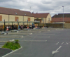 A 21st bus station somewhere in Great Britain.png