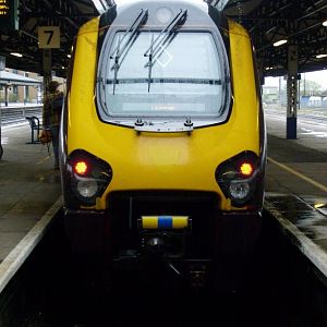 A Cross Country Voyager waiting at the bay platform at Reading with Manchester Piccadily to Bournemouth express