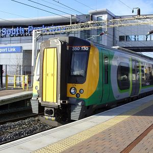 350130 stands at Liverpool South Parkway with a train for Birmingham New Street