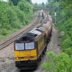 60075 with the Robeston - Westerleigh tanks on the outskirts of Gloucester.