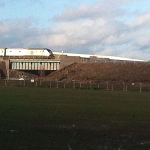 The DVT of today's 1H58 emerges into shot. It is traveling up to London (left to right in this shot) - on the tracks furthest from where this shot was